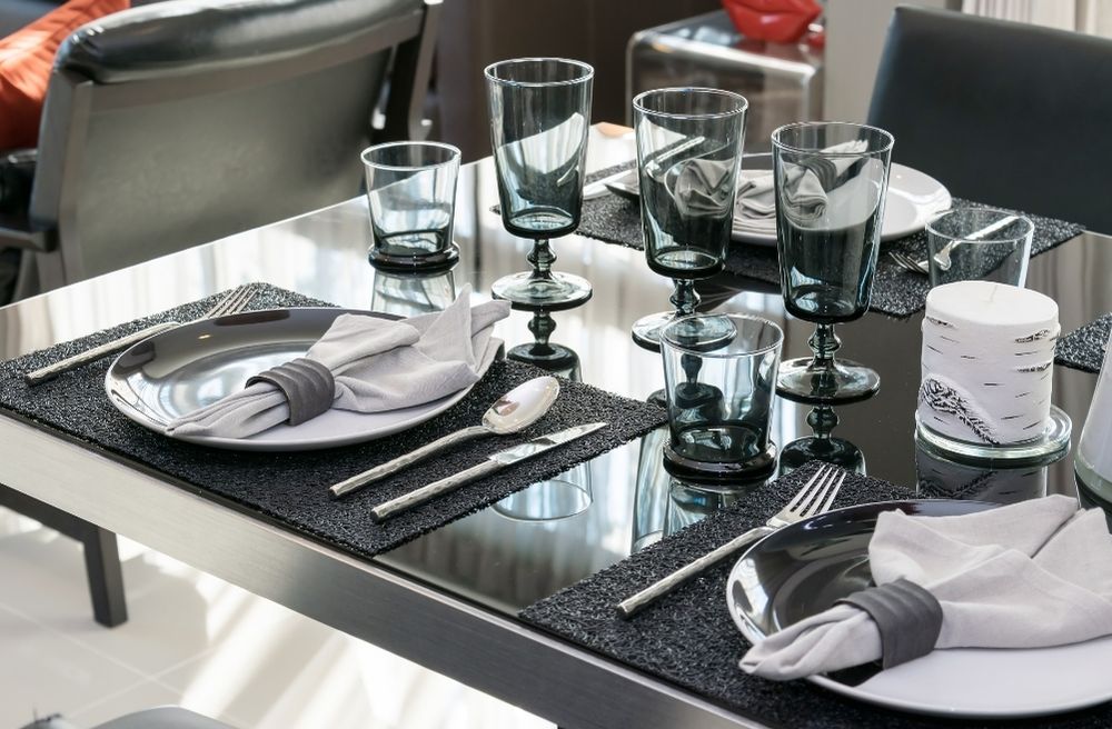 A monochrome dining table with black and white tableware.