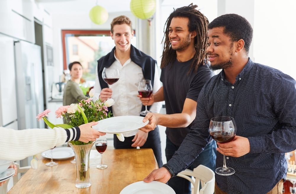 Friends setting table together