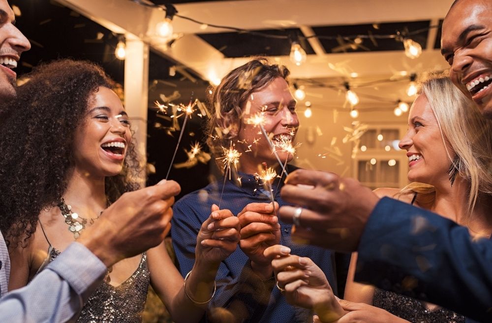 Friends celebrating New Year together at home