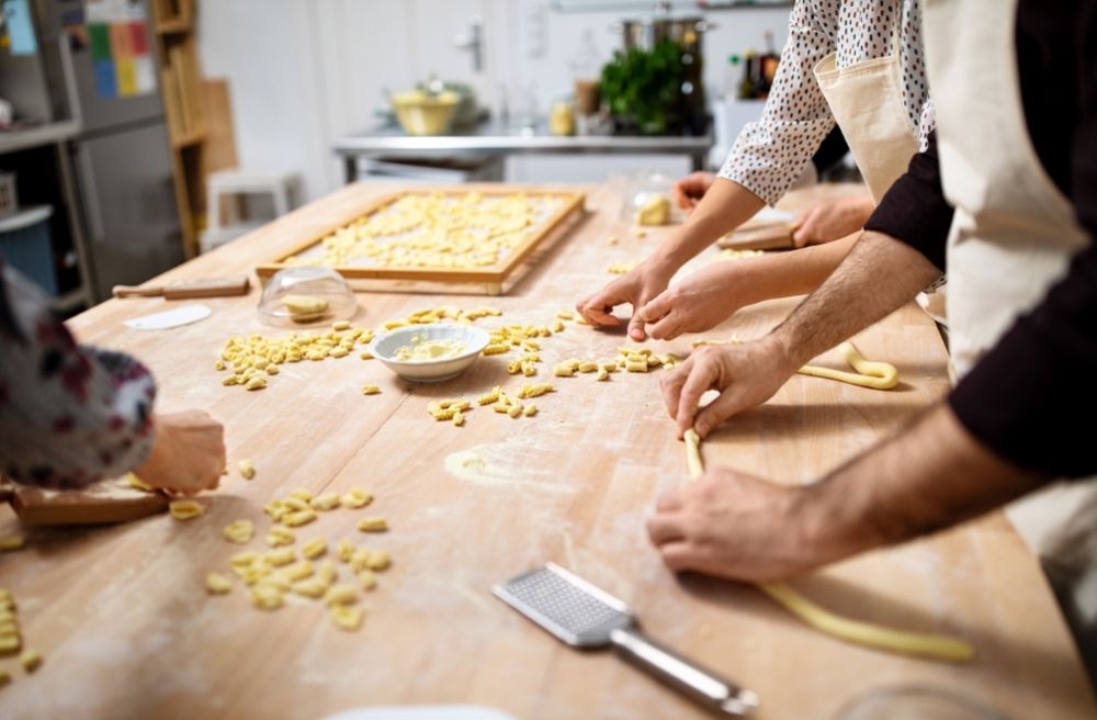 Friends making fresh pasta