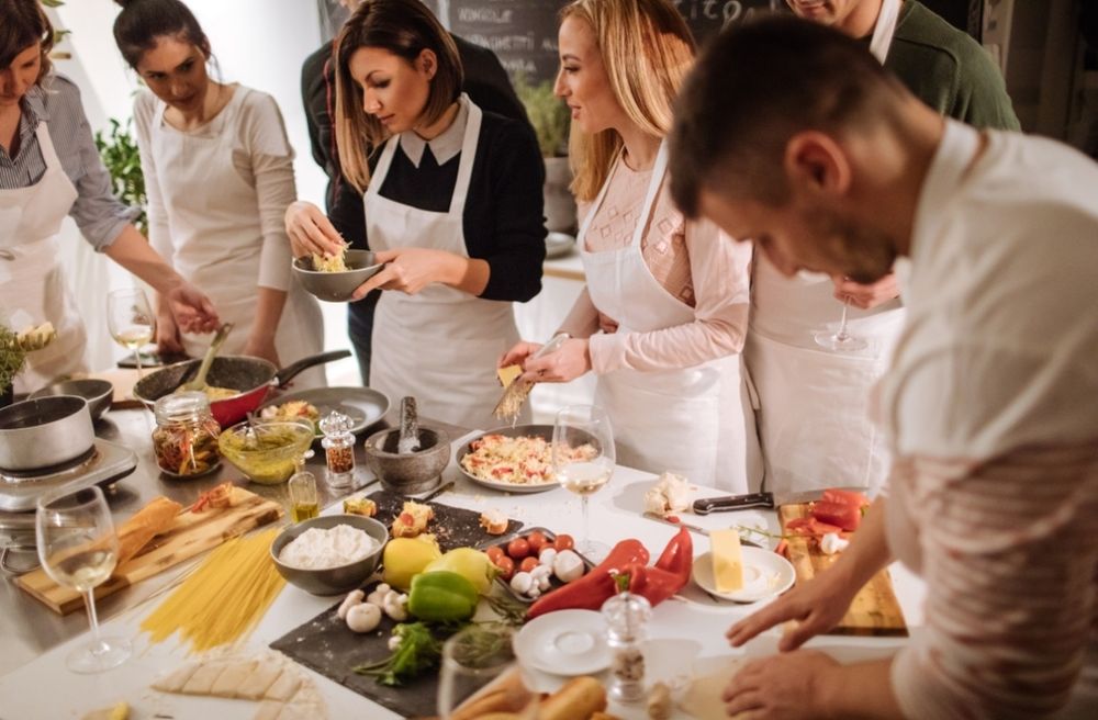 Guests cooking together in a home kitchen