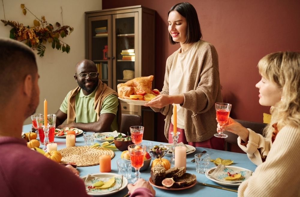 Host serving drinks to guests