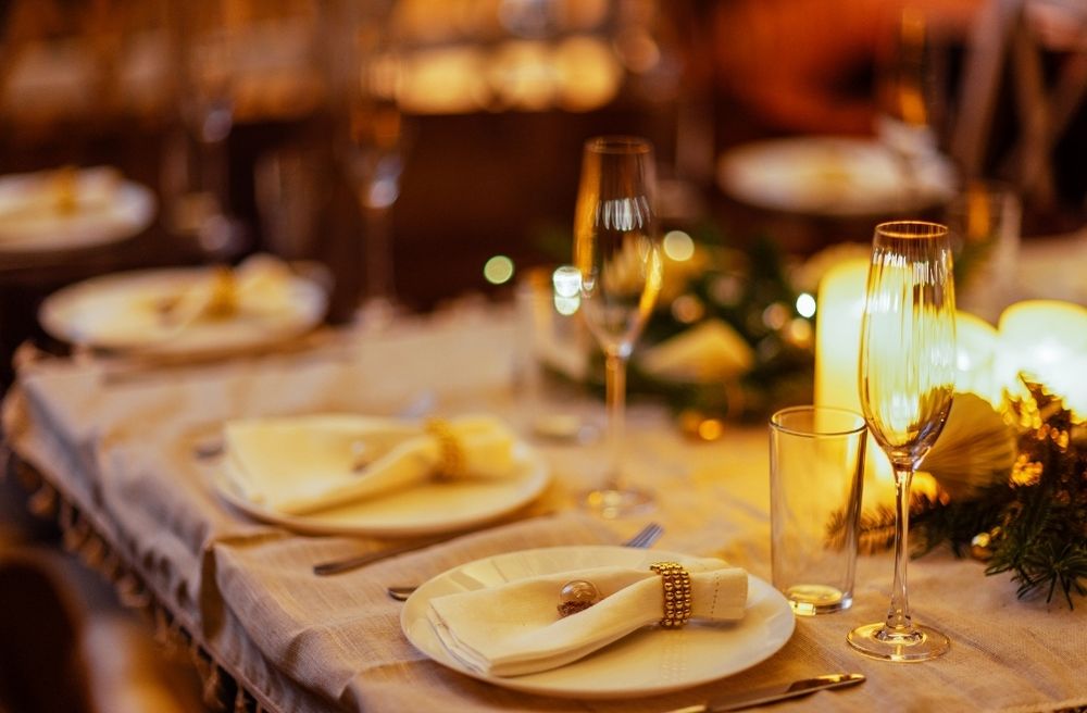 cozy dinner party atmosphere with candles and soft lighting