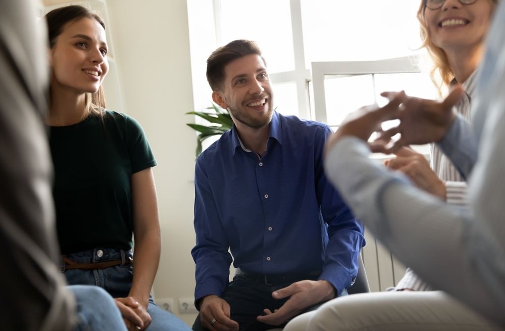 diverse group conversation at home