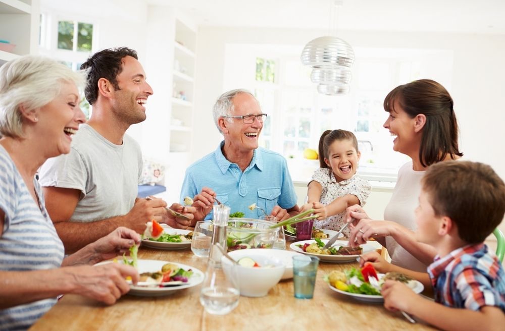 family talking around dining table