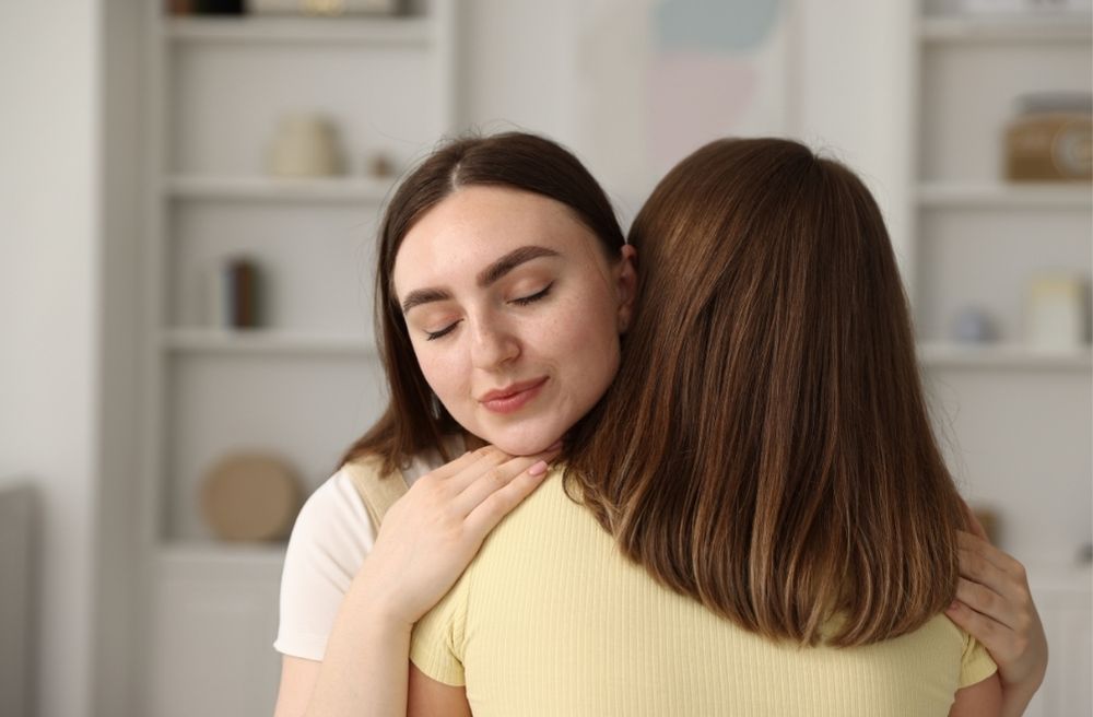 friends hugging after dinner party