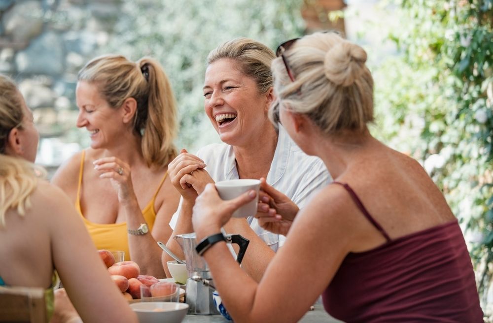 friends laughing after small spill at dinner