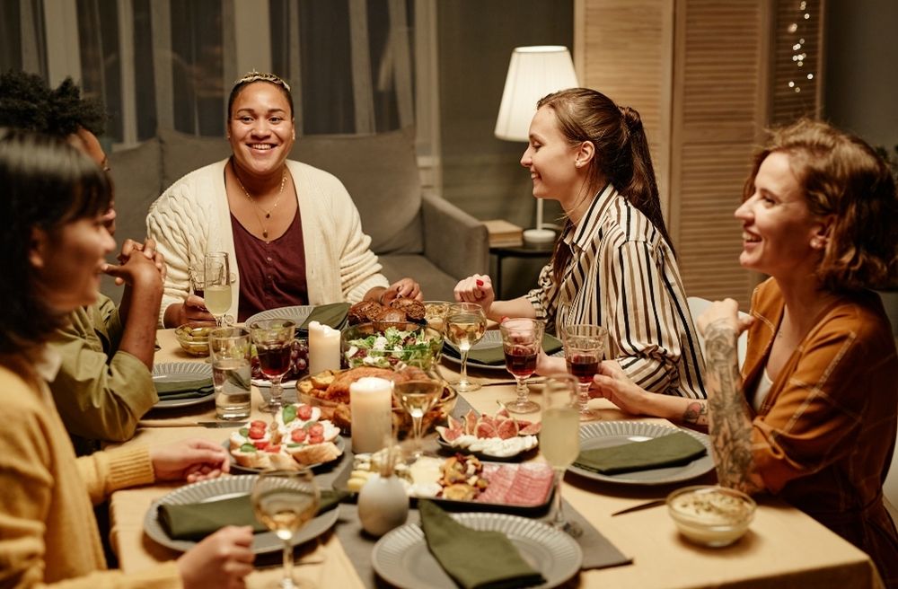 friends laughing at dining table