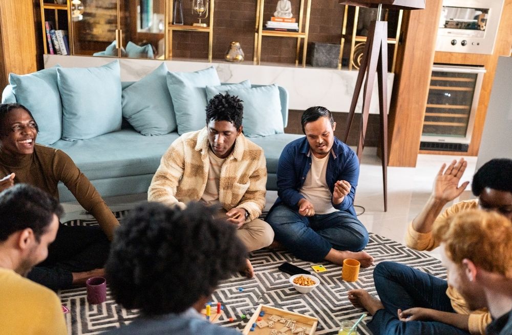 friends playing board games at home