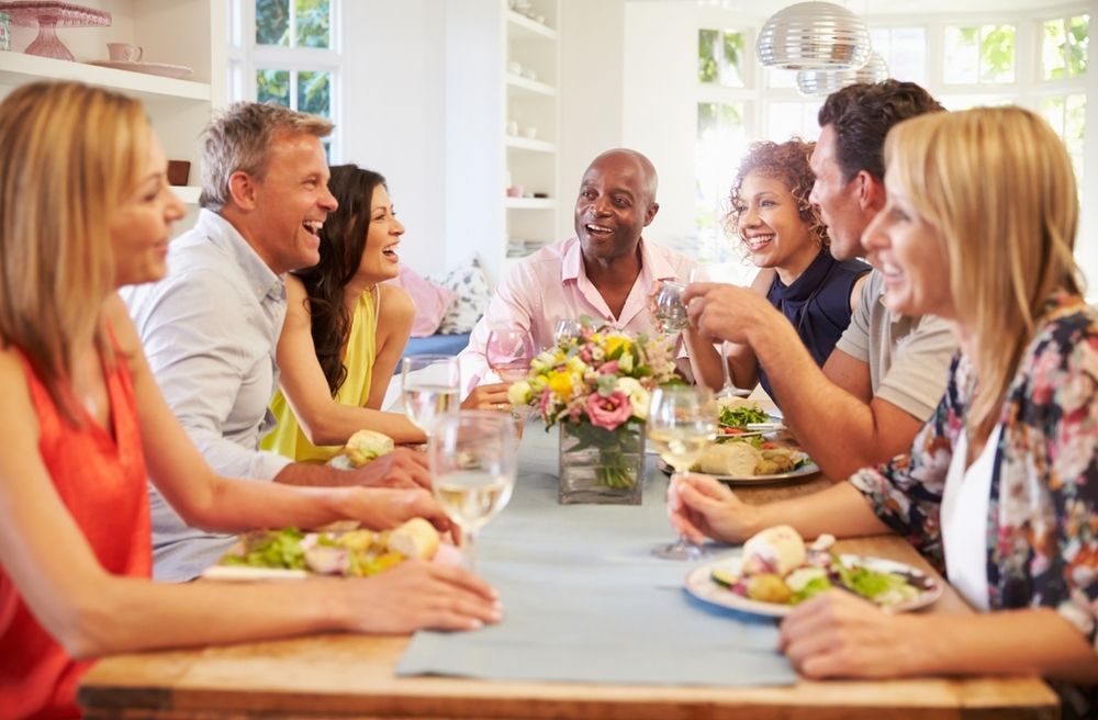 friends talking around dinner table