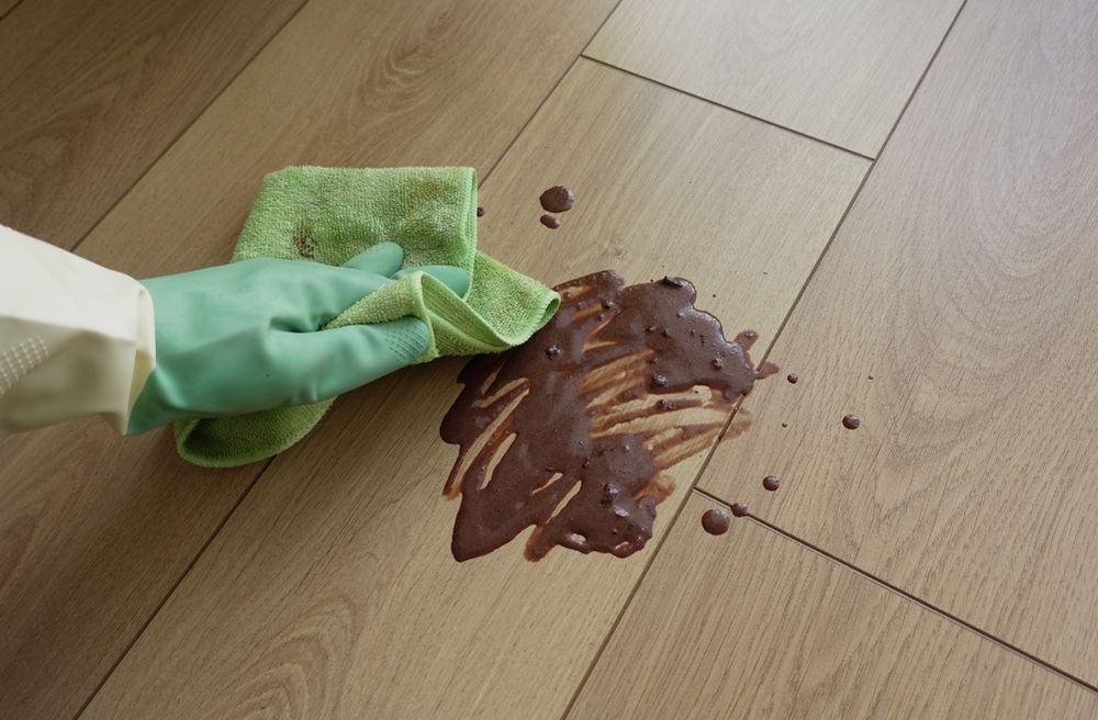 host calmly cleaning spill