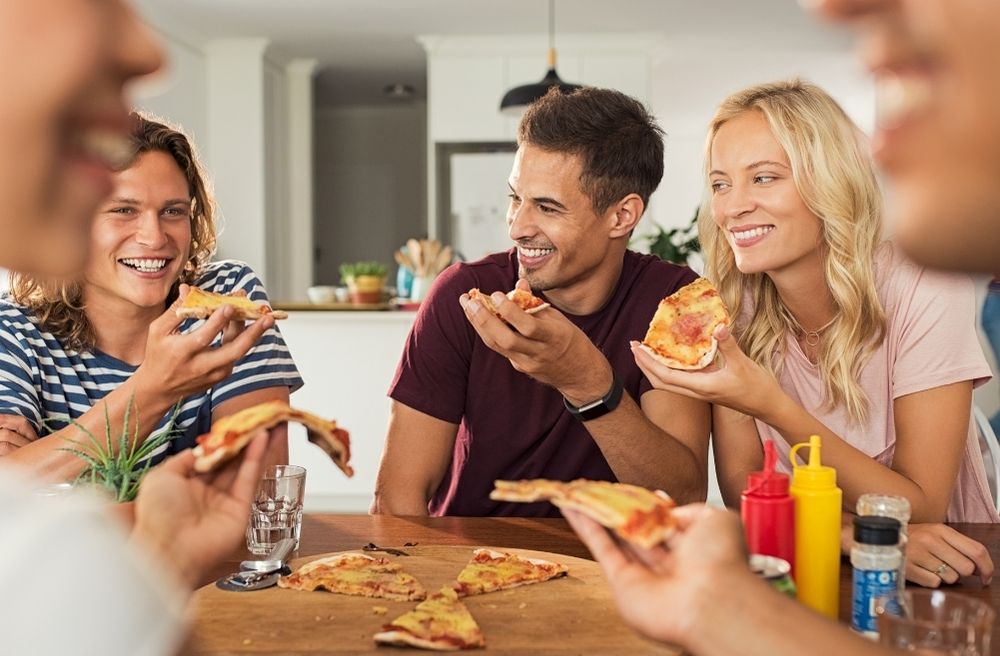 host eating with guests