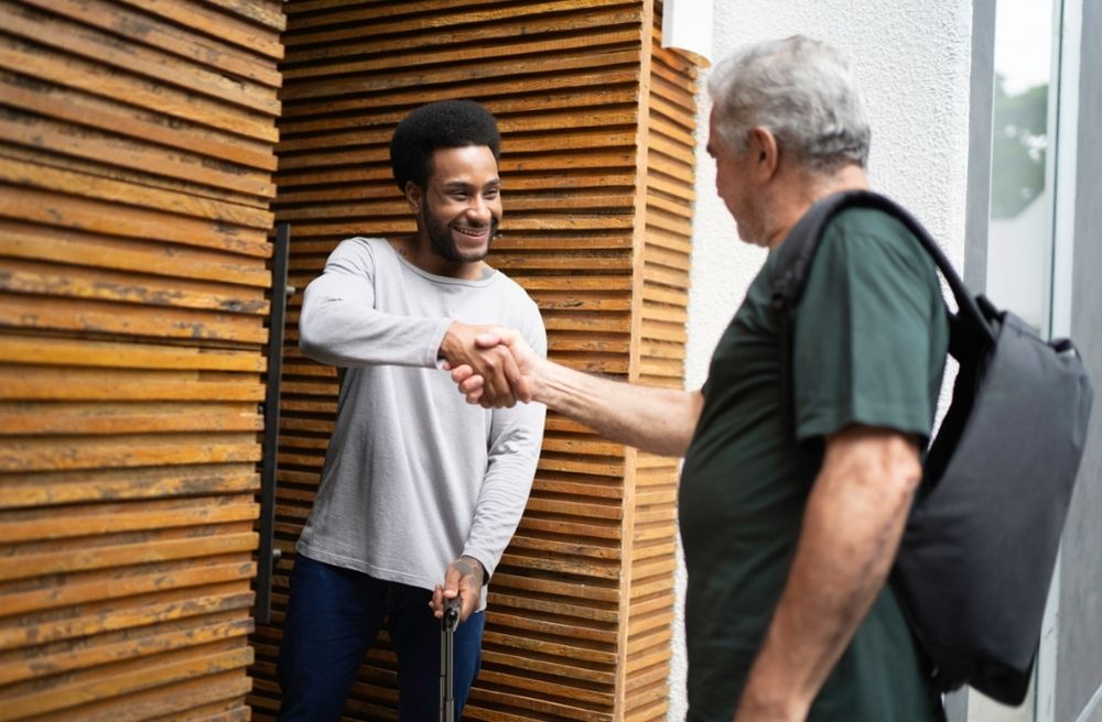 host greeting guests front door