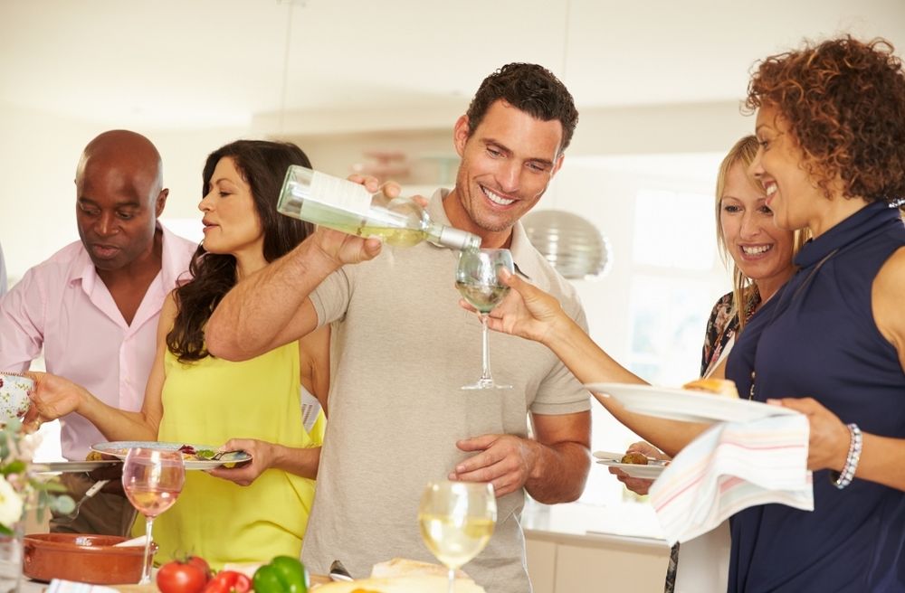 host refilling guest drink