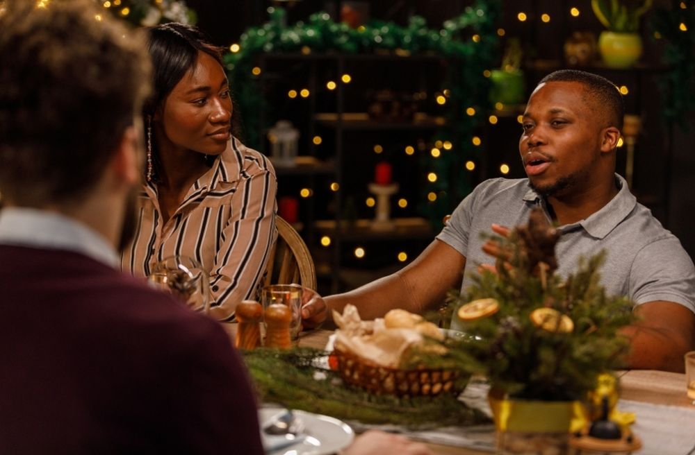 Host telling story dinner party