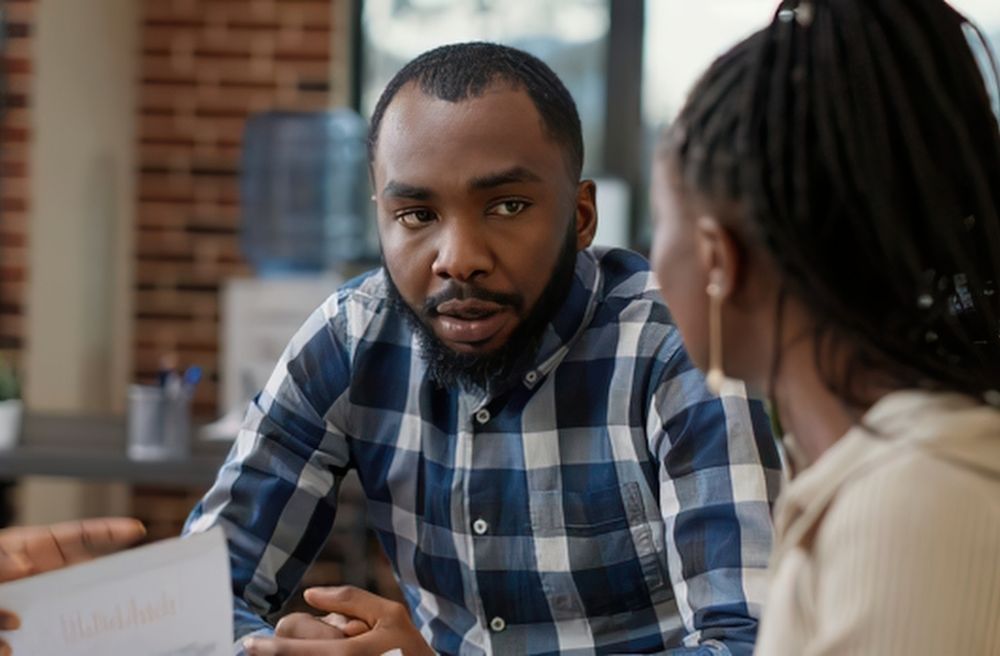 Man listening attentively during dinner conversation