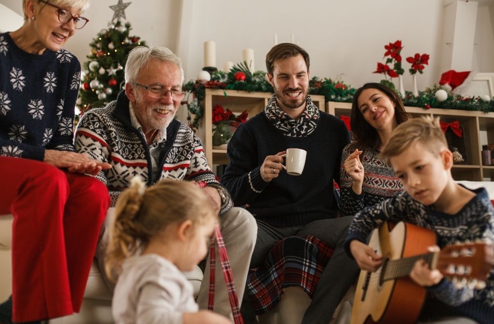 multi generation family enjoying music together at home