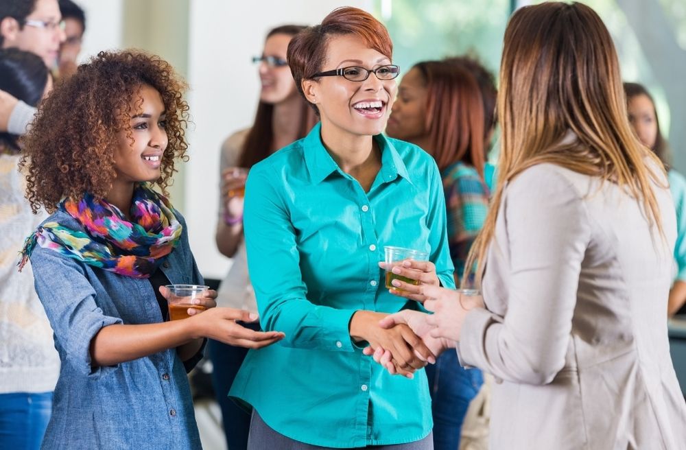 small groups talking at party