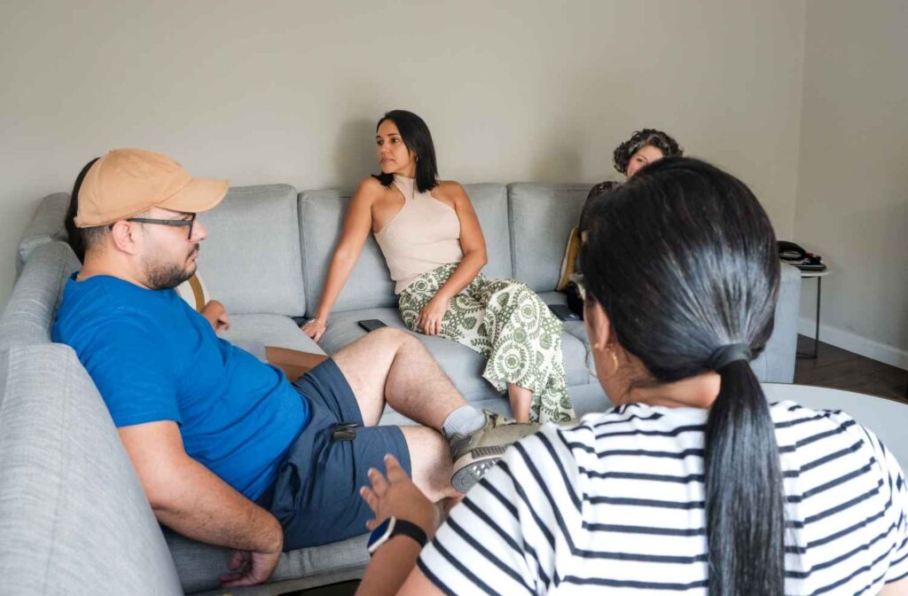 Close friends having a casual conversation about an upcoming gathering