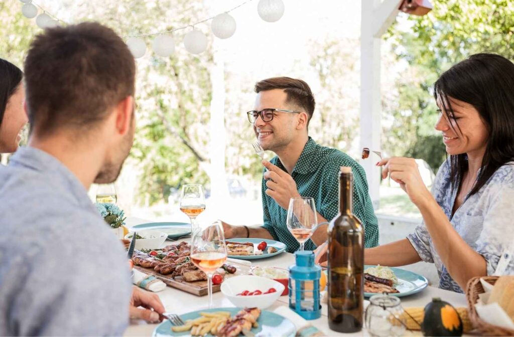 friends eating and talking at table