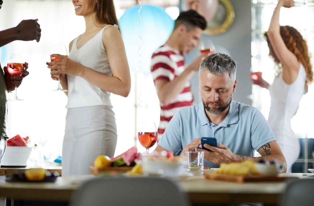 guest sitting alone at party
