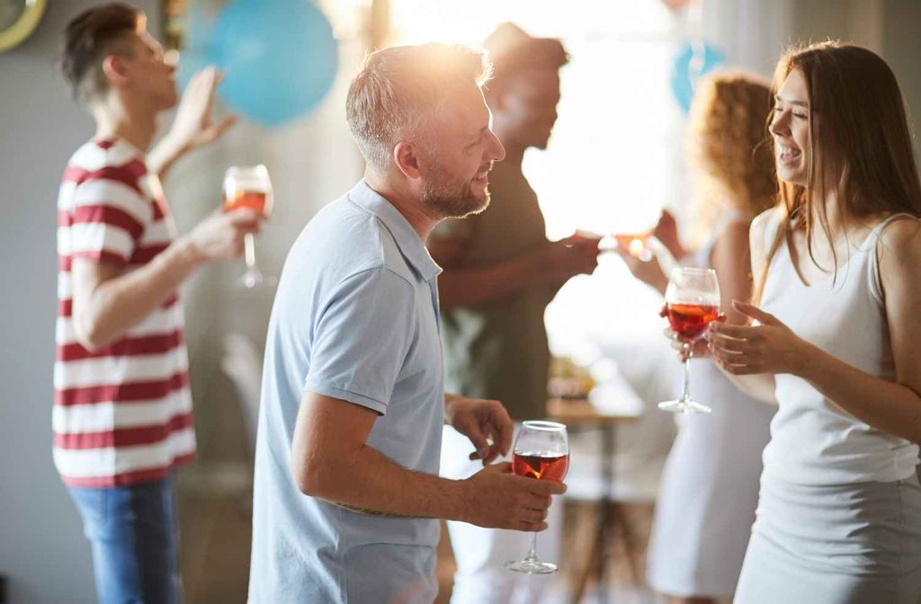 guests discussing shared hobbies at party