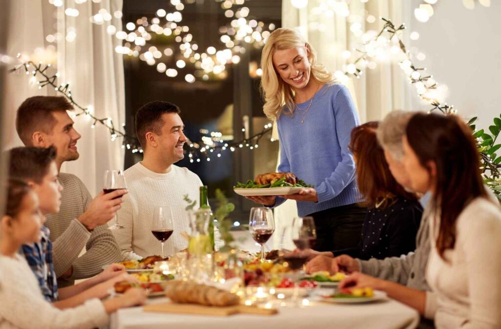 host serving food at dinner