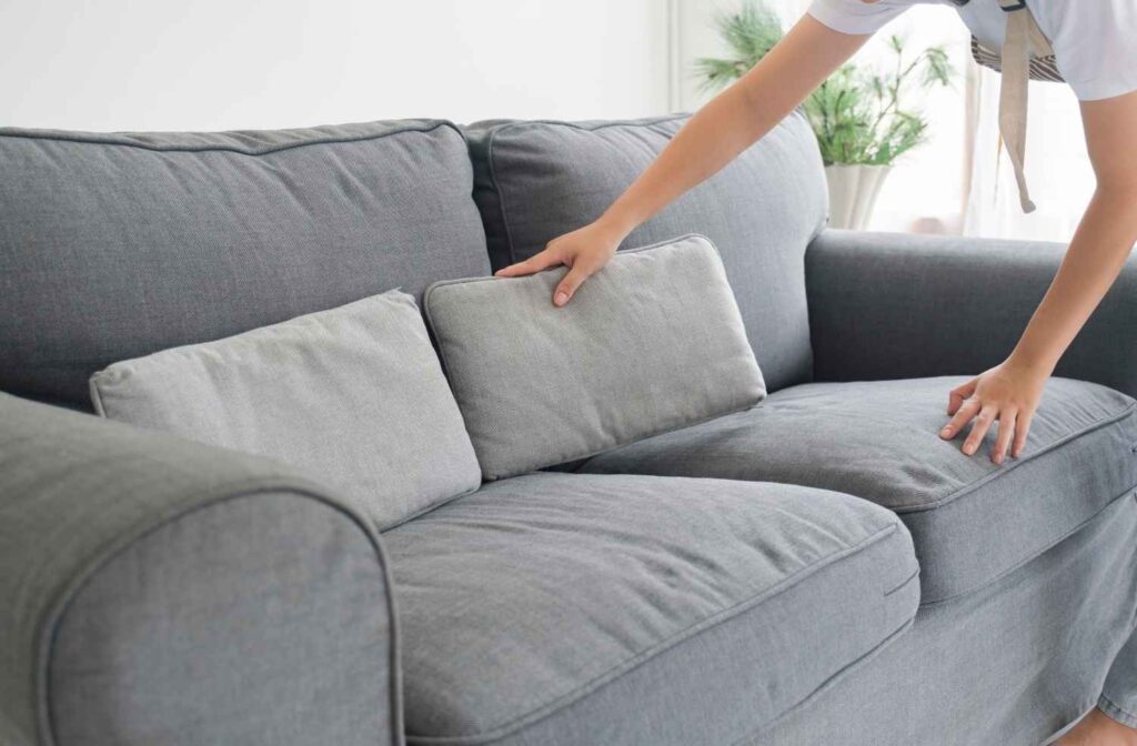 tidying living room before guests arrive