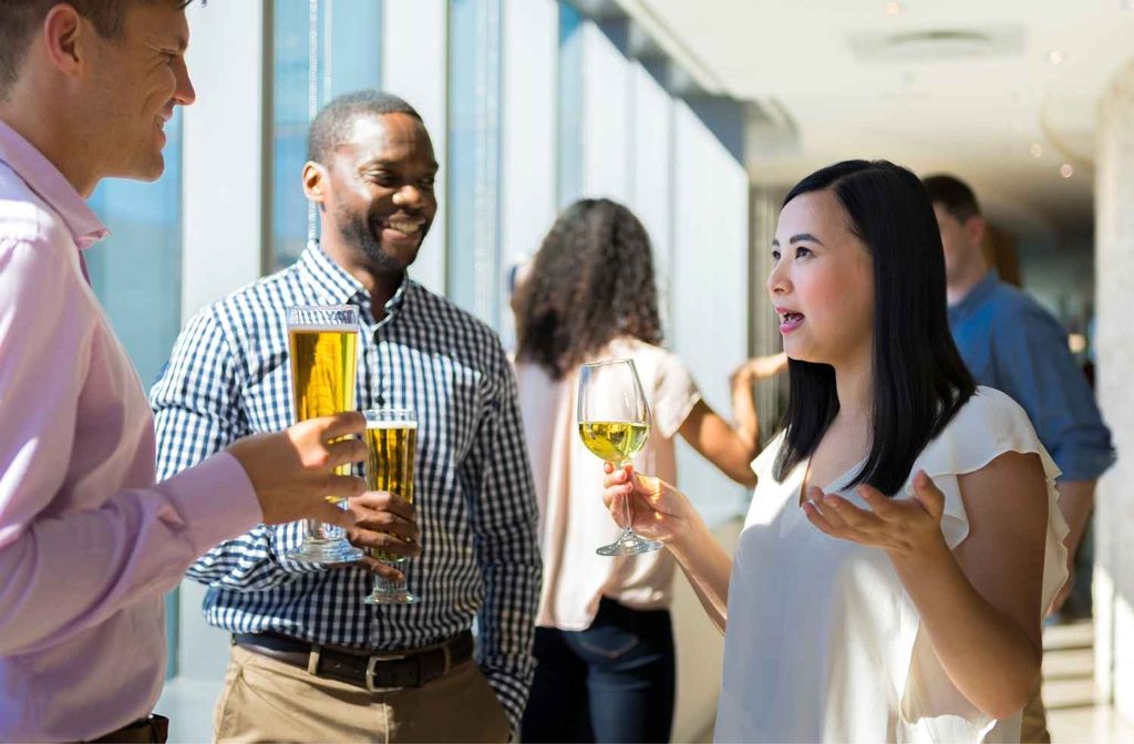 two guests talking at party