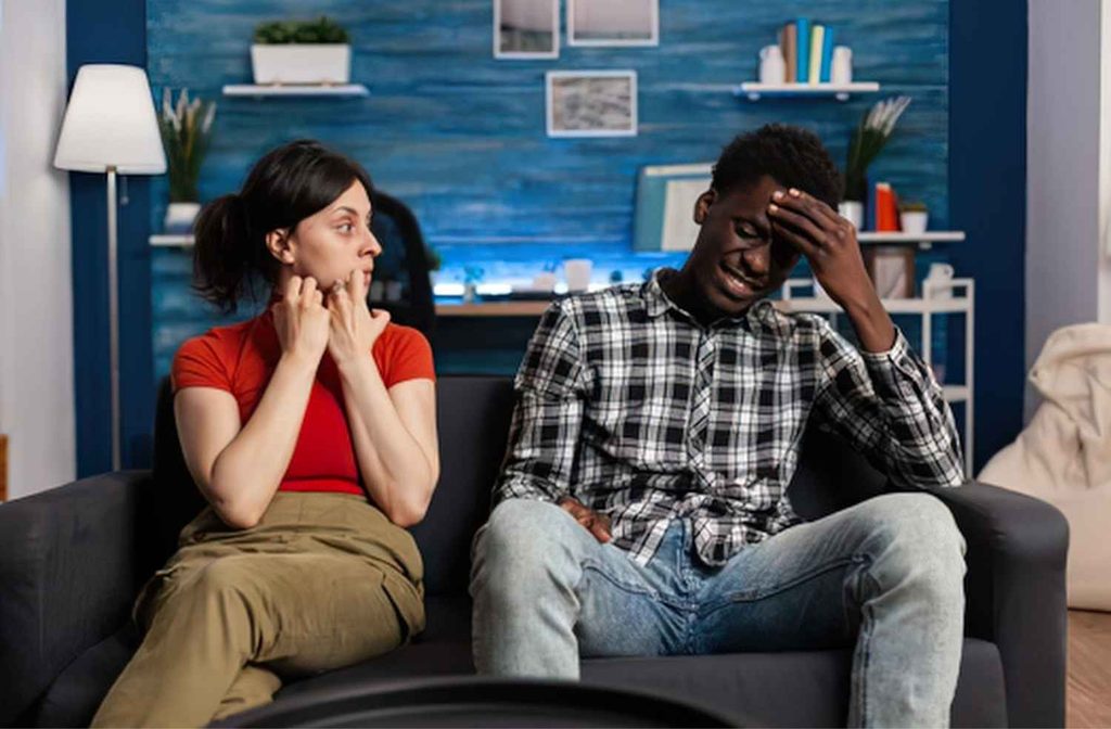uncomfortable guests sitting living room