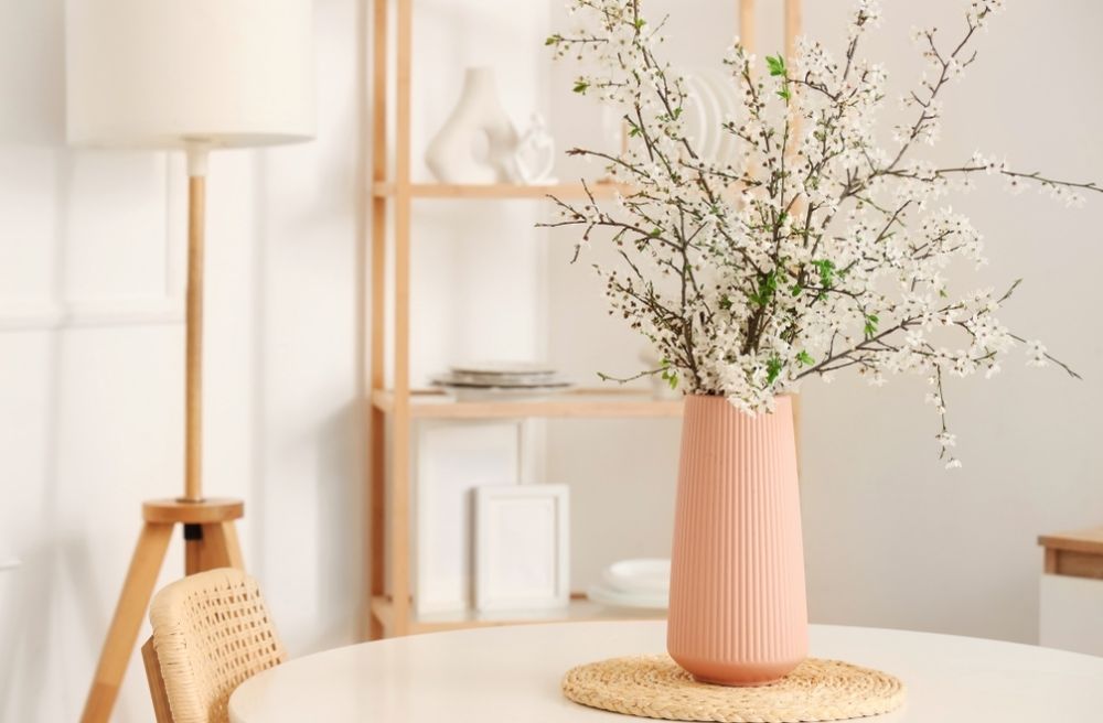 branches in tall vase dining table center piece