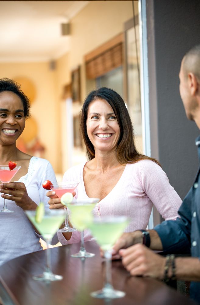 host looking slightly overwhelmed while guests are enjoying themselves