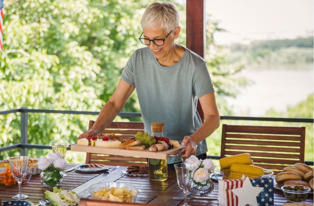 host setting food on the table