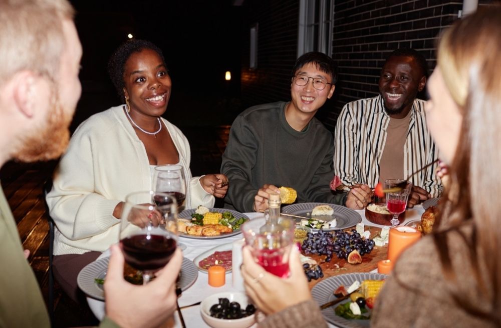 friends sharing food stories dinner