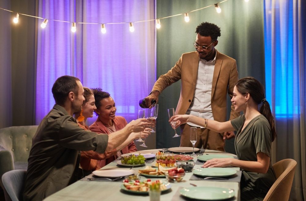 host offering drinks snacks