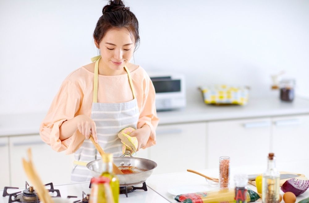 relaxed host preparing food
