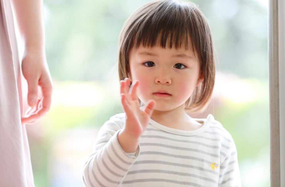toddler saying goodbye guests