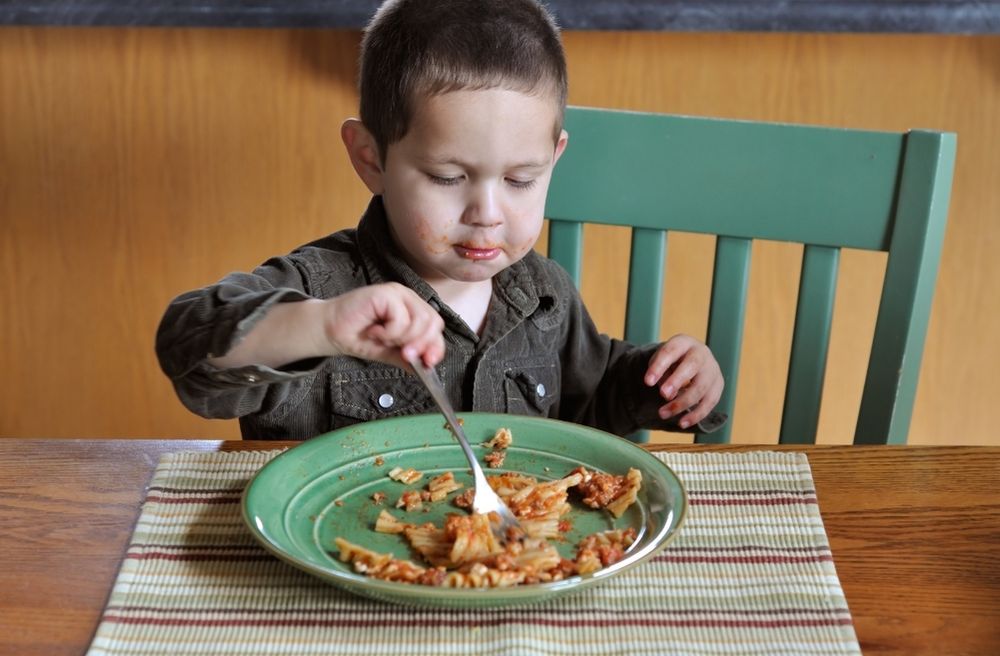 young child enjoying the meal